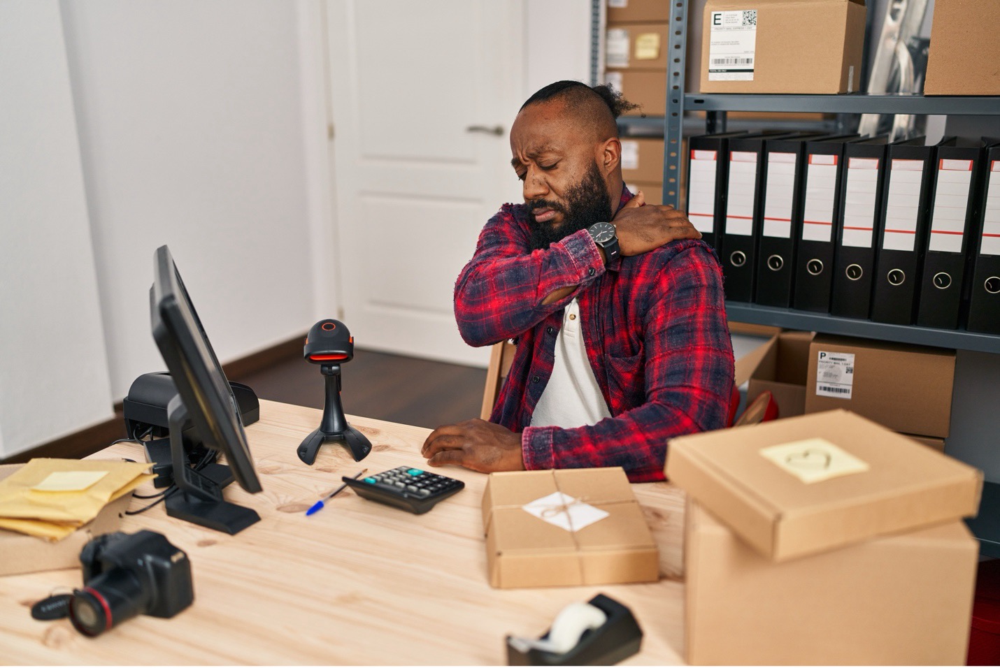 Man in pain because of workplace fatigue